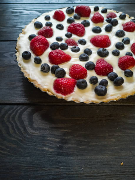 istock Tart with blueberries and strawberries 1293812148