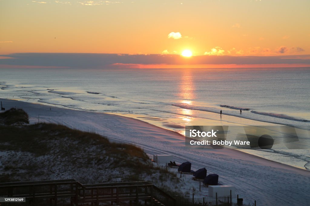 Destin Florida Sunrise Sunrise over the ocean in Destin Florida looking down at the beach and surf Beach Stock Photo