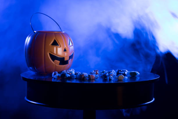 istock Pumpkin Jack O Lantern Trick or Treating Bucket with Candy 1293812984