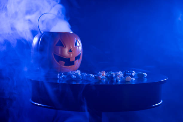 istock Pumpkin Jack O Lantern Trick or Treating Bucket with Candy 1293812986