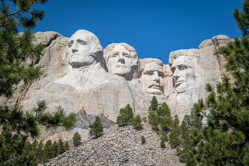 The busts of Presidents George Washington, Thomas Jefferson, Teddy Theodore Roosevelt, and Abraham Lincoln carved Borglum into the Black Hills of South Dakota at Mount Rushmore