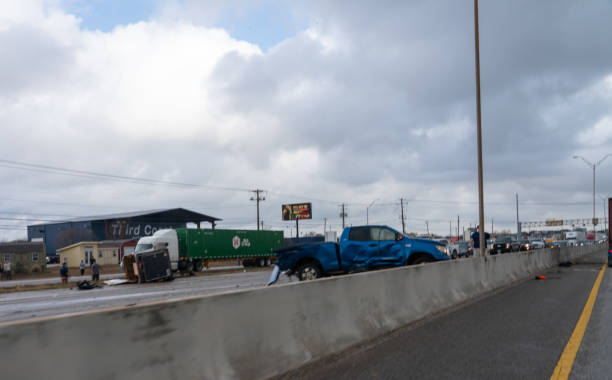 Pickup Truck and Semi Truck on Interstate 35 After Accident Austin, Texas - December 30, 2020: Pickup Truck and Semi Truck on IH-35 After Accident truck in rain stock pictures, royalty-free photos & images