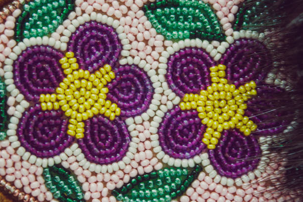 Close-up of hand-beaded Moccasins A close-up photo of hand-beaded Indigenous People's of Canada footwear indigenous peoples day stock pictures, royalty-free photos & images