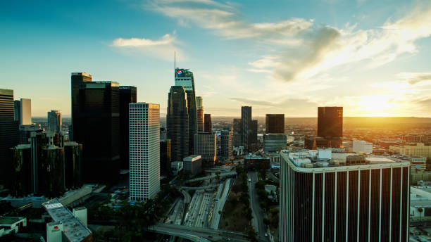 istock Freeway Passing Skyscrapers of Downtown LA at Sunset - Drone Shot 1293815529
