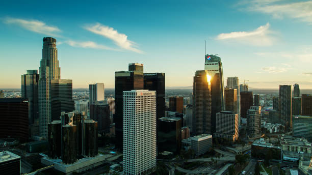 istock Evening Sunlight Reflecting on Skyscrapers of Downtown LA - Aerial 1293815532