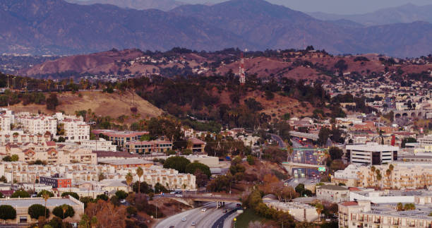 istock Freeway Heading Between Apartment Buildings in Los Angeles - Aerial 1293815539