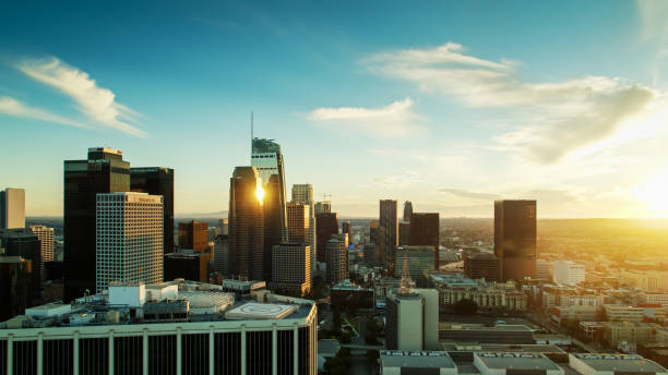 istock Setting Sun Glinting on Downtown LA Financial District Skyscrapers - Drone Shot 1293815568