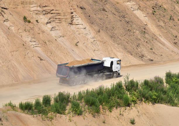 istock Truck with tipper semi trailer transported sand from the quarry 1293817838