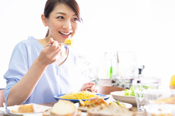 istock asian woman who eats 1293820757
