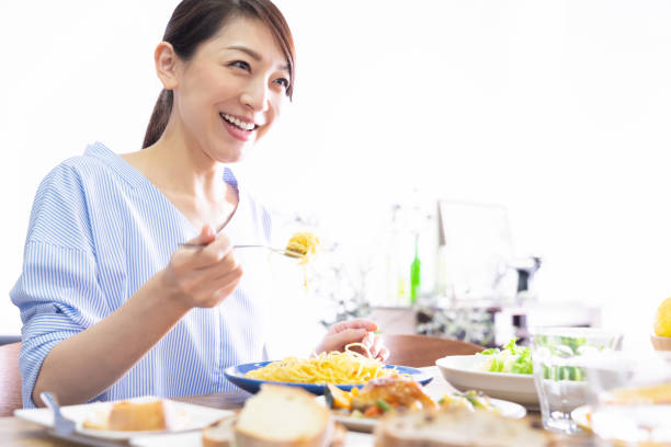 istock asian woman who eats 1293821278