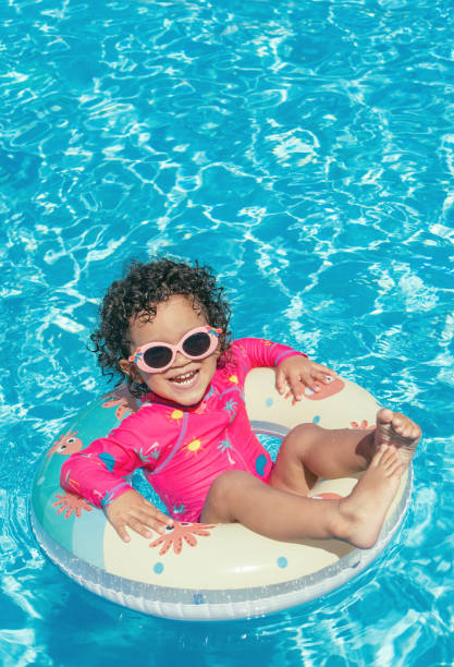 istock Little girl enjoys the pool 1293822005