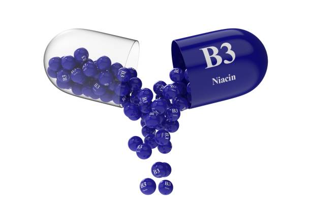 istock Open capsule with niacin from which the vitamin composition is pouring 1293822036