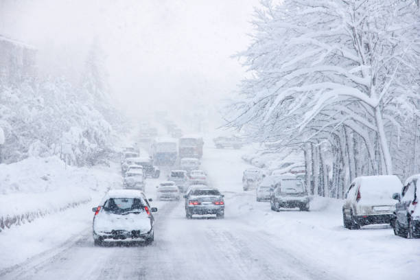 istock Cars drive along the highway during a blizzard. 1293824546