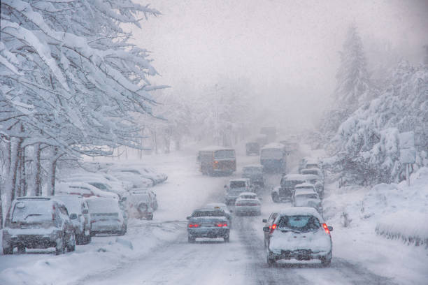 istock Cars drive along the highway during a blizzard. 1293824553