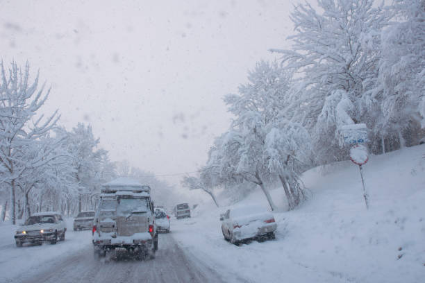 istock Cars drive along the highway during a blizzard. 1293824554