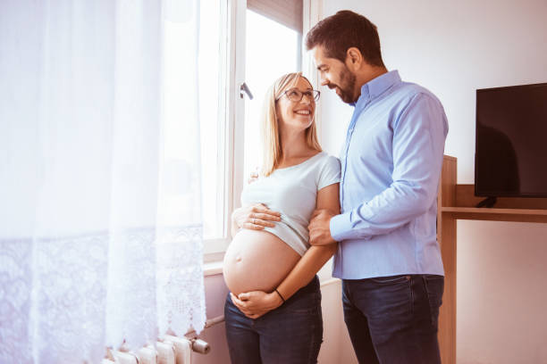 istock Happy young couple expecting baby 1293826002