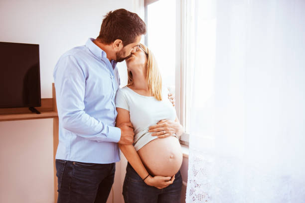 istock Happy young couple expecting baby 1293826052