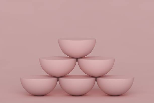 istock 3d render, abstract primitive geometric shapes isolated on pink background. Pyramid, rows of pink hemispheres. Blank platform showcase, podium, empty pedestal. Balance concept. Modern minimal design 1293837994