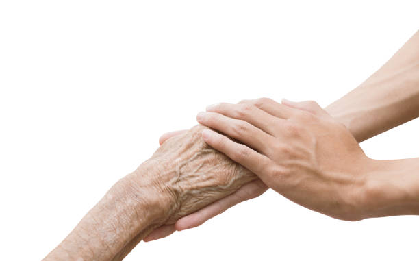 una persona che tiene una mano un'anziana donna isolata su sfondo bianco con percorso di ritaglio. - consoling close up senior adult grandparent foto e immagini stock