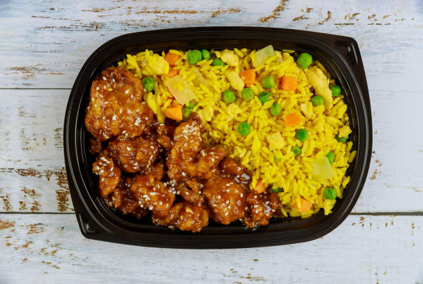 istock Teriyaki chicken with rice and vegetables in plastic food container. 1293842508