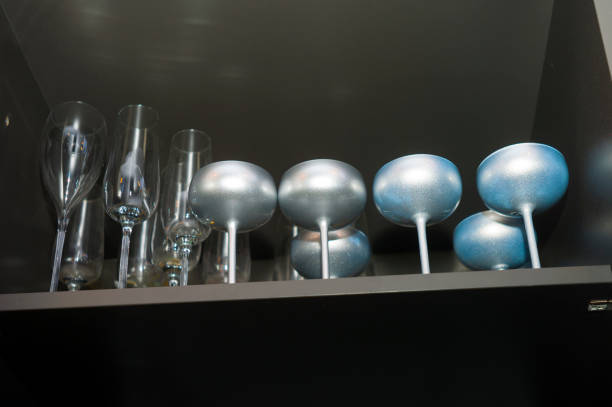 Low angle crooked shot of the wine and champagne glasses placed on the shelf