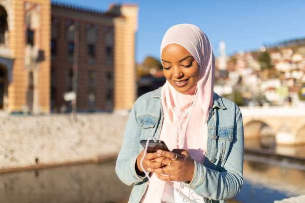 istock Happy Middle Eastern woman using a smart phone 1293844299