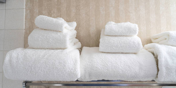 istock White Towels folded on rack in Hotel washroom 1293846602