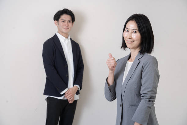 istock Business person standing in front of the wall 1293846607