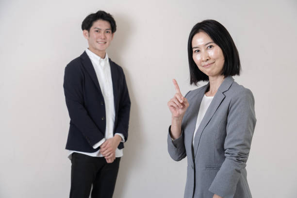 istock Business person standing in front of the wall 1293846621