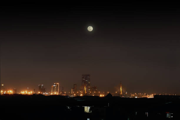 istock Night city lights with skyscraper building architecture, skyline horizon cityscape downtown night scene at full moon night. 1293846671