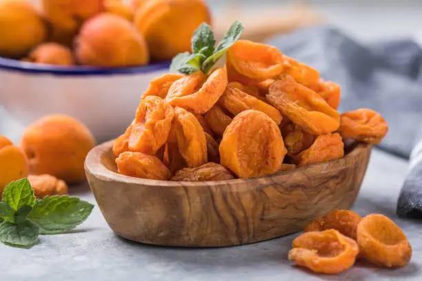 Photo of Dried apricots are popular in cooking, sweet dried fruit, healthy food, compote making.