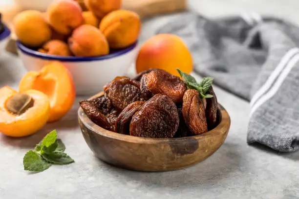 Photo of Dried apricots are popular in cooking, sweet dried fruit, healthy food, compote making.