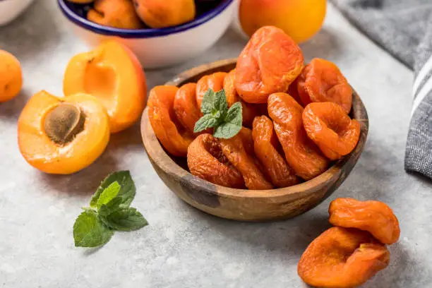 Photo of Dried apricots are popular in cooking, sweet dried fruit, healthy food, compote making.