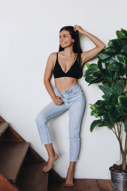 istock Beautiful young woman at home 1293857482