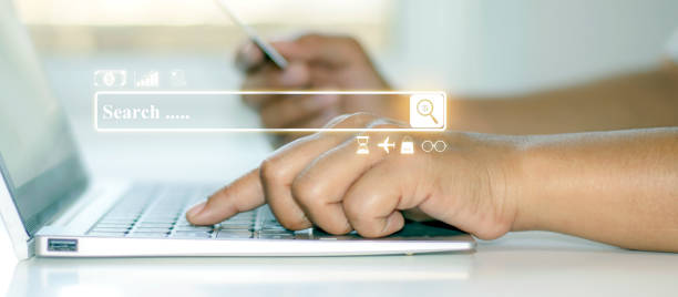 istock The address bar, the web interface for searching for financial transactions, and a close-up view of businessmen searching for information with a notebook. 1293861850