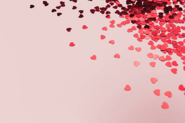 istock Red heart glitters on the pink background 1293862638