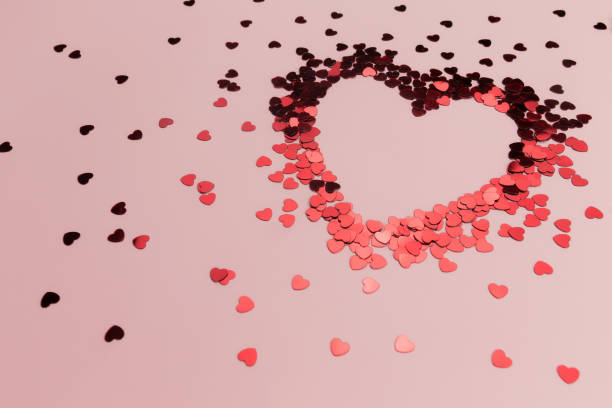 istock Red heart glitters on the pink background 1293862640