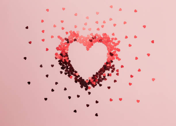 istock Red heart glitters on the pink background 1293862641