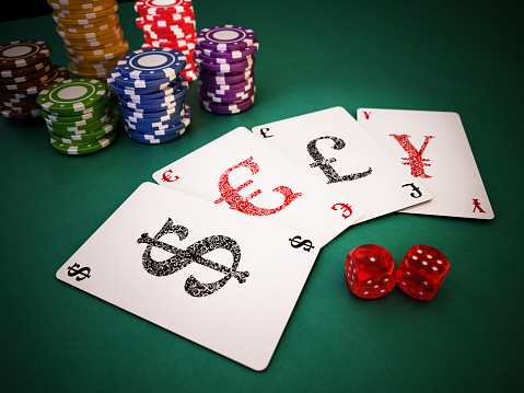 Set of playing cards with Dollar, Euro, Pound and Yen symbols.