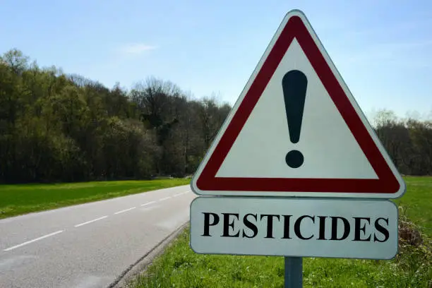 Concept of a sign indicating a danger due to the presence of pesticides