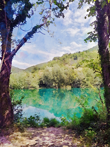 Watercolor effect on a photo of Soca valley, a waterfront view between a frame of two trees. Watercolor effect on a photography.