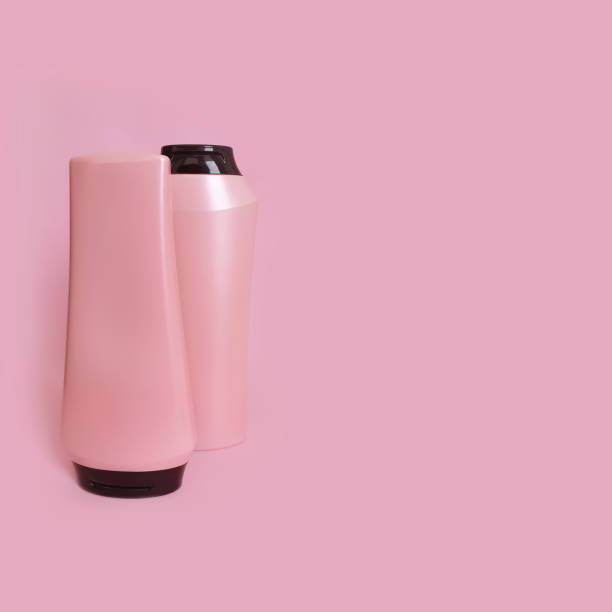 istock bottle of shampoo and balm on a colored pink background 1293876066