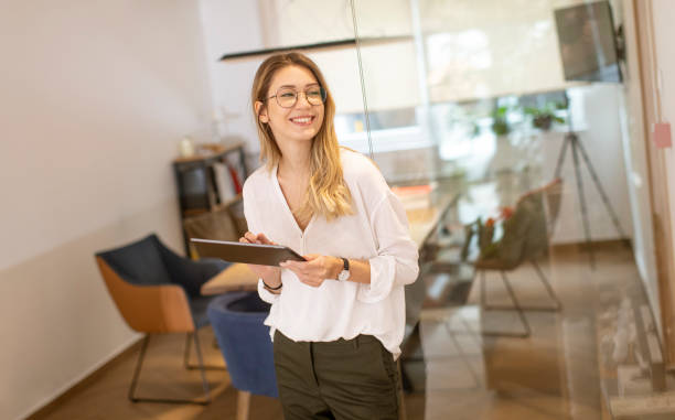 istock Young woman working with digital tablet in the office 1293876206