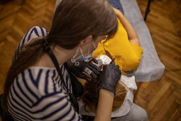 istock Preparing for tattoo eyebrows in salon. 1293877969