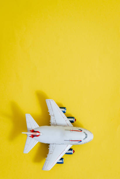 istock Model plane,airplane on yellow color background 1293879066