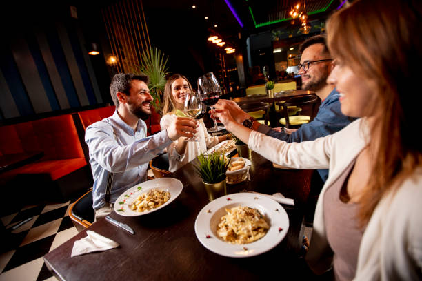 istock Young people having dinner in the restaurant 1293880158