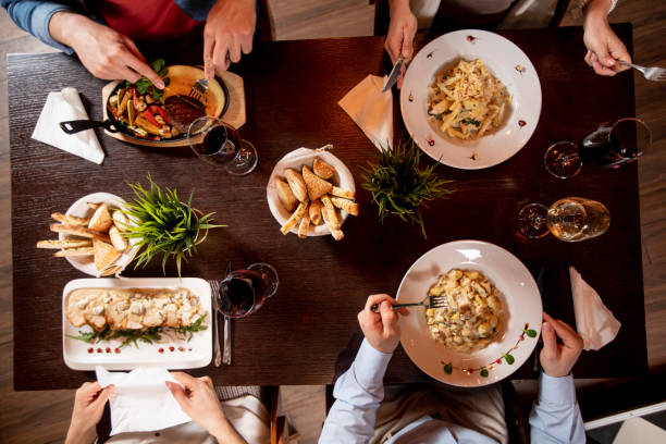 istock Young people having dinner in the restaurant 1293880164