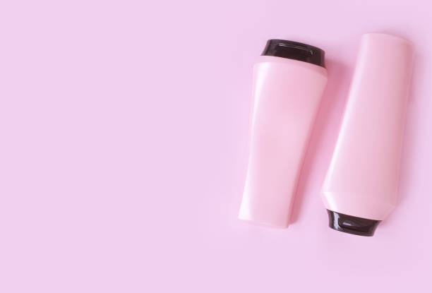istock bottle of shampoo and balm on a colored pink background 1293880375