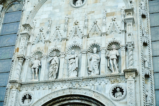 Statues on the facade of Como Cathedral. Como. Lombardy. Italy.