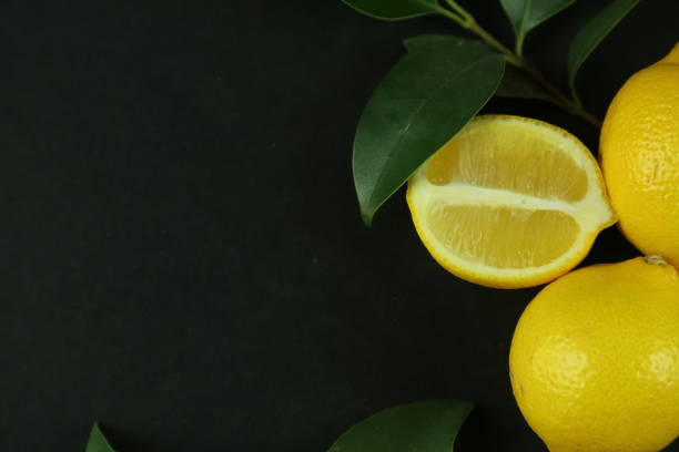 istock Group of lemons with leaves, isolated on background 1293884835